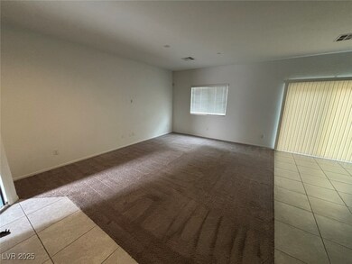 Spare room featuring tile patterned floors and carpet flooring