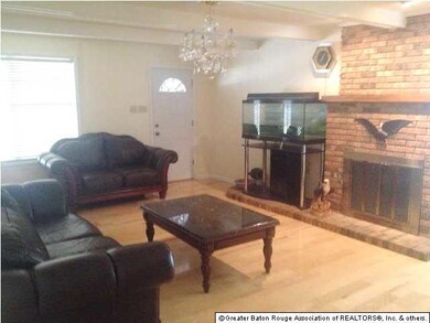 Living room with masonry fireplace