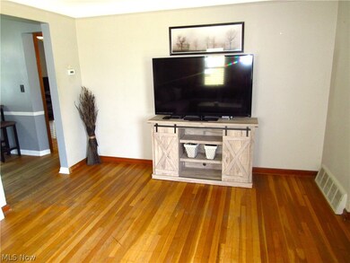 Unfurnished living room with hardwood / wood-style flooring