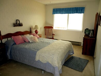 queen bed in large bedroom