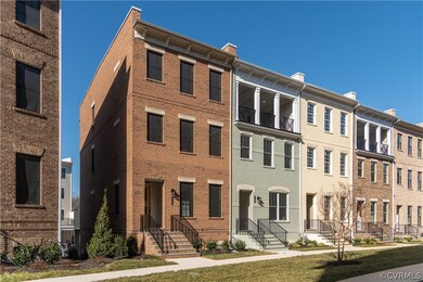 This row-end home has brick on the front and side.