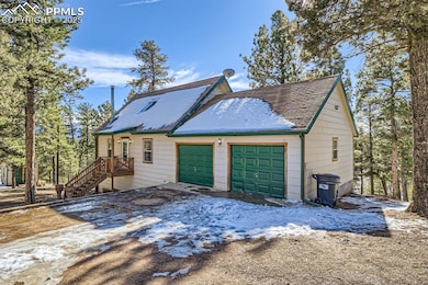 View of property exterior featuring a garage
