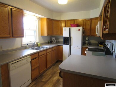 The kitchen opens to the dining and living room.