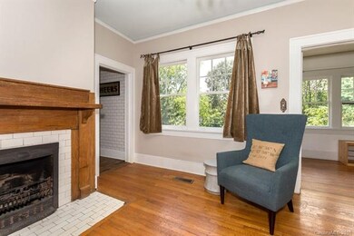 Charming historic details, gorgeous tiled fireplac