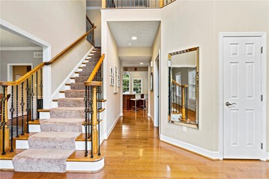 Two story foyer floods with light & invites you to