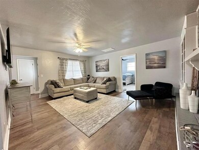 Living room featuring dark hardwood / wood-style f