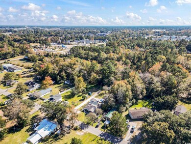 View of property location with nearby suburban area
