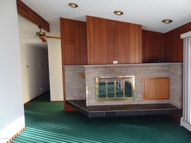Living room-sandstone gas fireplace