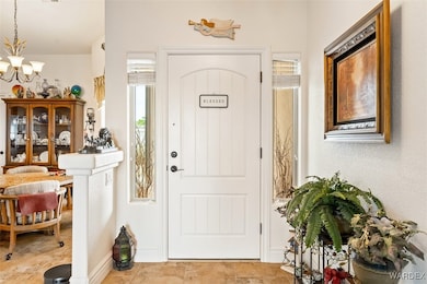 Entryway with an inviting chandelier