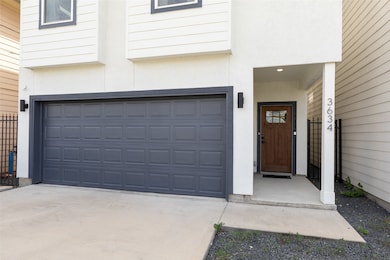 Open Covered Front Porch leading up the Walkway with Two Car Garage