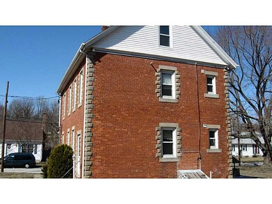 Exterior Back. Brick, granite and vinyl trim exrer