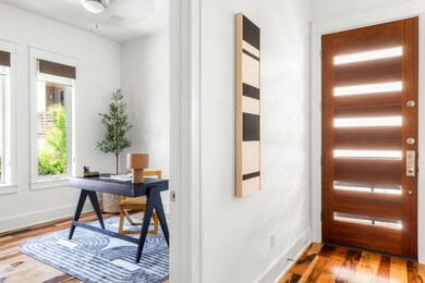 Foyer entrance featuring wood finished floors and