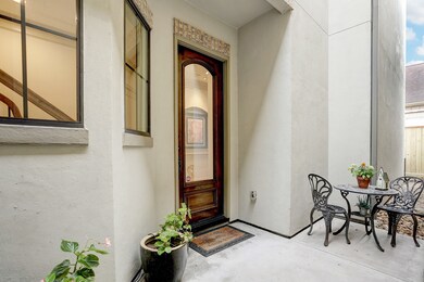 SOLID MAHOGANY FRONT DOOR WITH GLASS INSERT.  ENJOY YOUR COFFEE ON PRIVATE PATIO AREA