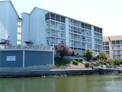 Lakeside of Building with beautiful landscaping an
