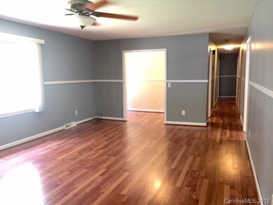 New wood laminate flooring throughout living area,