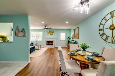 Dining area with wood finished floors, ceiling fan