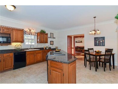 Kitchen. Expansive kitchen offers crown molding, g