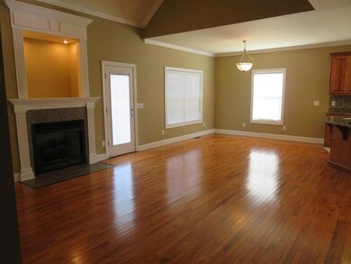 Another angle of Den, FR DR and shows how it opens to Kitchen with eat in bar