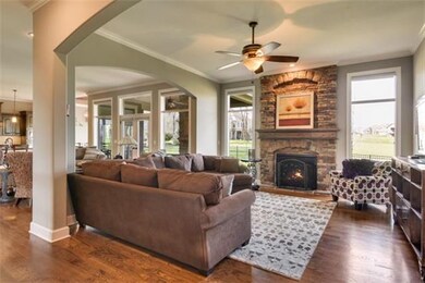 Great room w/ floor to ceiling stone fireplace.