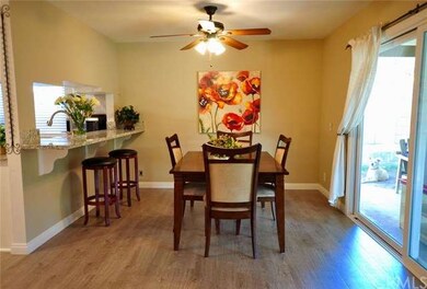 SPACIOUS DINING AREA OFF OF THE LIVING ROOM HAS A 
