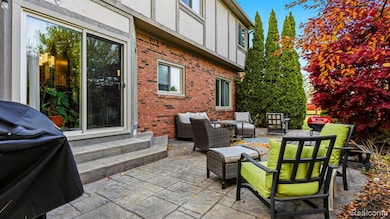 View of patio with outdoor lounge area, area for grilling, and entry steps