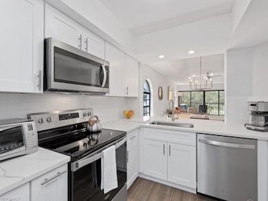 Kitchen featuring stainless steel appliances, whit