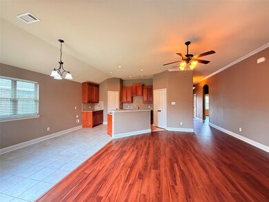 Unfurnished living room with arched walkways, a chandelier, healthy amount of natural light, lofted ceiling, and light wood-type flooring