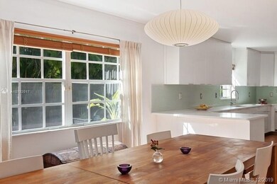 FAMILY AREA OFF QUARTZ COUNTERED KITCHEN