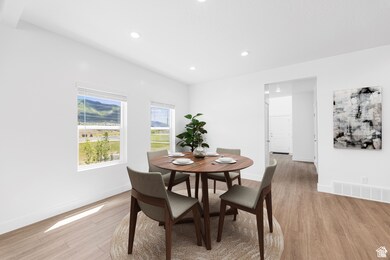 Dining area featuring recessed lighting and light wood-type flooring