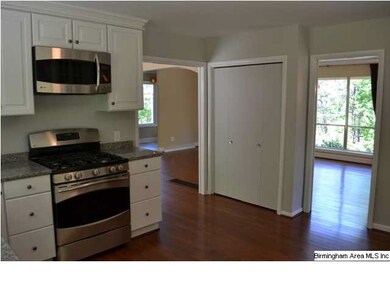 Kitchen has large pantry and is open to dining and