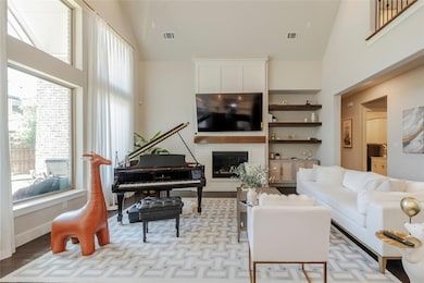 Living room featuring high vaulted ceiling and light wood-type flooring