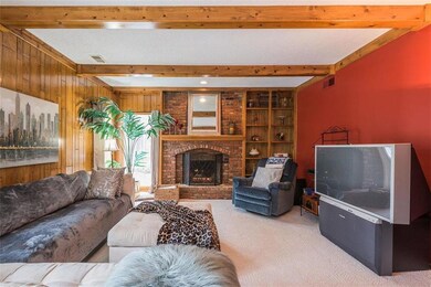 Family room, box beam ceiling, gas fireplace, buil