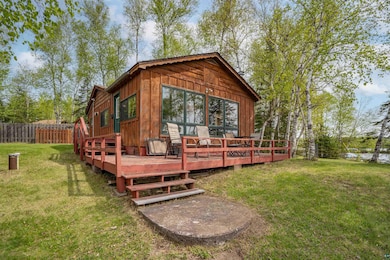 Rear view of house featuring a deck