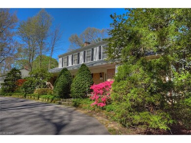 Front view of home and horseshoe driveway.