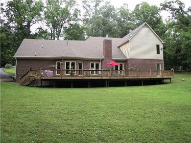 The back of the home features a beautiful deck spa