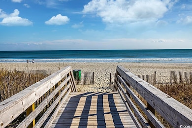 View of property's community with a beach view and