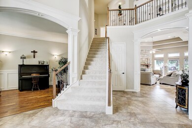 To the left of the front door is a formal living room with custom wood working around the doorway and wainscoting on the walls.  This room could also be used as a study.