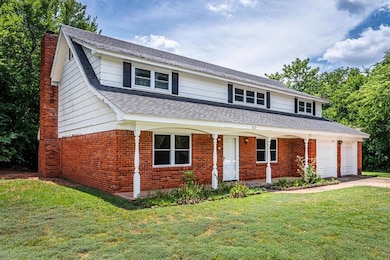 View of front of property featuring a garage and a