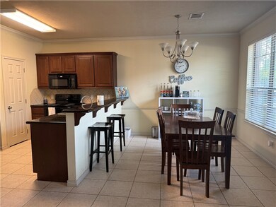 Dining space with a chandelier, healthy amount of