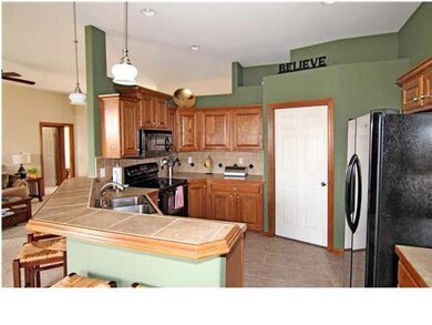 Kitchen with walk-in pantry, tiled floor, stainles