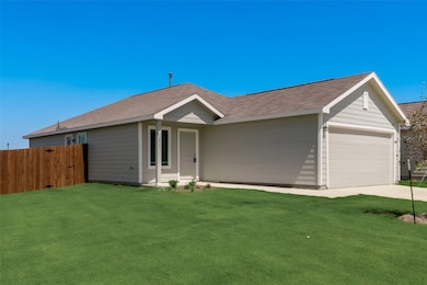 Single story home with an attached garage, driveway, and a shingled roof