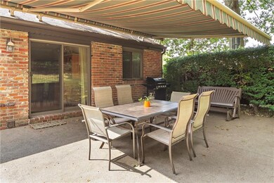 Retractable Awning extends over the large concrete