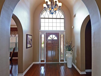 Stunning entry with beautiful windows, chandelier.