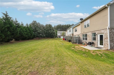 View of yard with fence, a patio, and central AC u