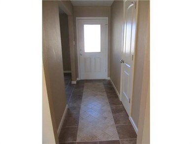 Foyer. Front entry features a beveled glass door,