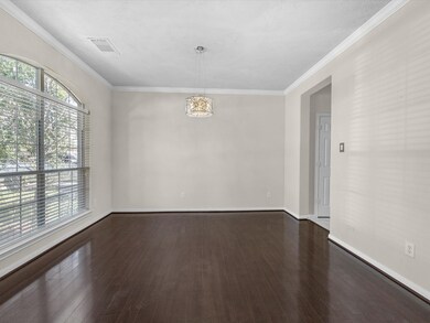 This is a spacious, well-lit room with large windo