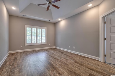 Empty room with a ceiling fan, dark wood finished floors, recessed lighting, and baseboards