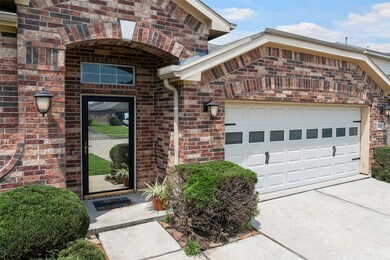 with an inviting entrance and upgraded 2-car garag