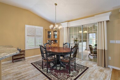 Eat in area of kitchen with plantation shutters an