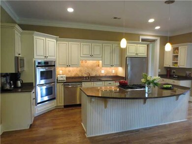 Large open kitchen with stainless steel appliances